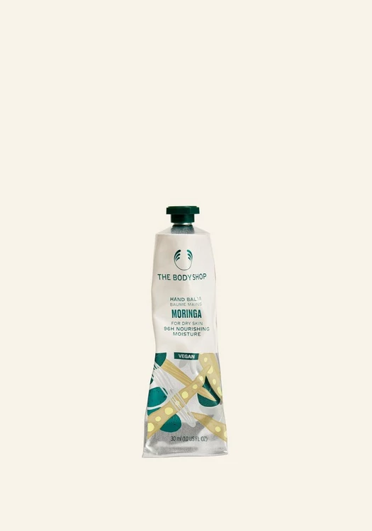 کرم دست مورینگا و شی باتر رنگ زرد کمرنگ بادی شاپ مناسب دست های خشک جدا شده از گیفت ست MORINGA hand balm